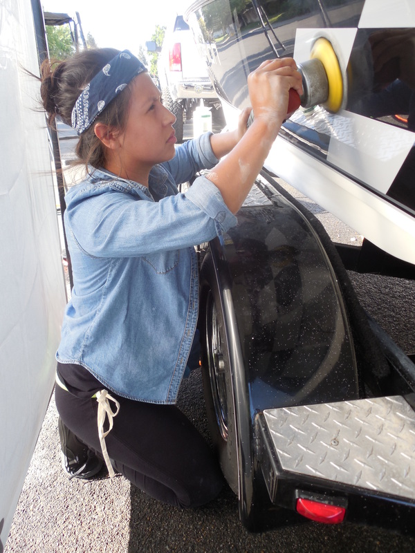 caryn of detail pros doing some oxidation removal and polishing work on this boat detail in yuba city